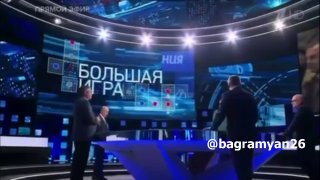 Александр Ионов, член СПЧ при президенте РФ, в зеленом на фоне студии федерального канала